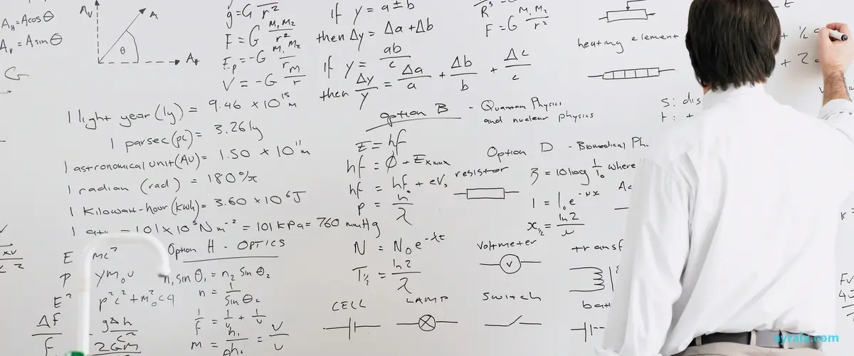 Rear view of a teacher writing on a whiteboard in front of a classroom