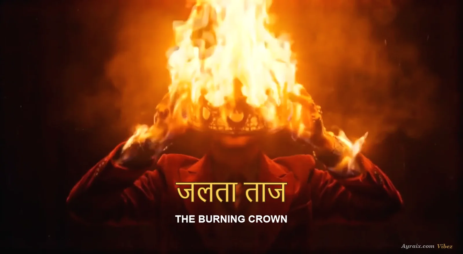 The artist holding the burning crown aloft